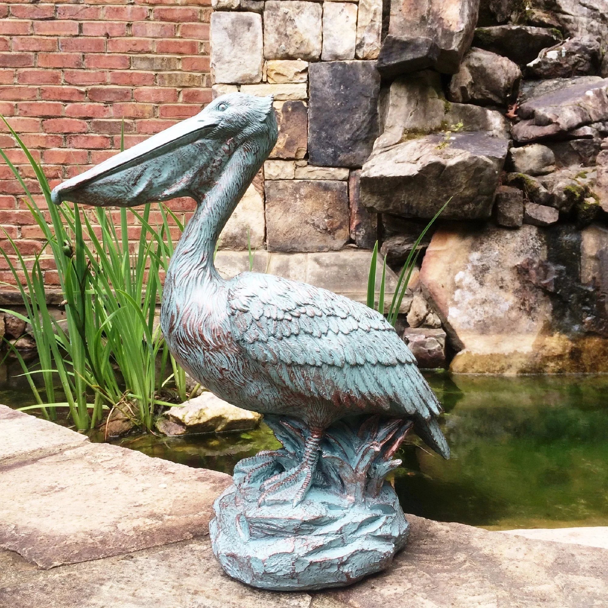 Homestyles 20 in. Bronze Patina Pelican on Coastal Rock Nautical Beach Sizetatue